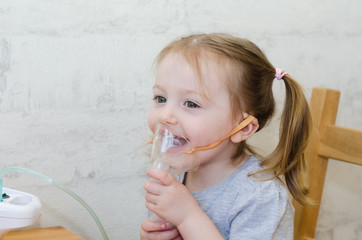 little siling girl makes inhalation