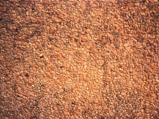 Stone patterned walls and small orange gravel for the background.
