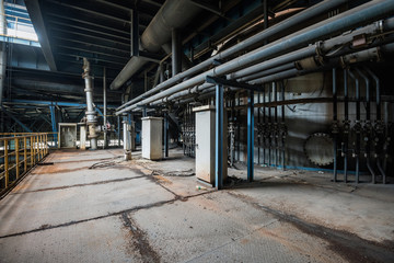 Fototapeta premium Interior of of an old abandoned industrial steel factory