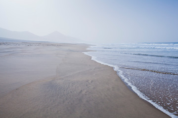 Beach landscape -  Cofete, Fuerteventura, Canary Islands. Perfect place for the coast lovers. Tourist holiday destination, background, copy space.