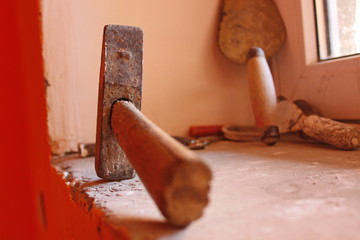 old rusty tool on abandoned construction site
