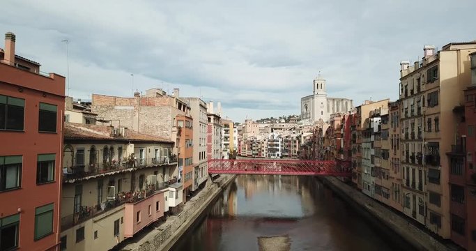Aerial image of Rio de Girona with bridge eiffel Church and mountain in background