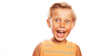 Close up of pretty little boy with blond hair screaming loudly, trying to scare friend in school....