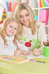 Mother with little daughter counting