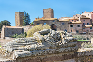 View of Tuscania with Etruscan statue - Viterbo Italy