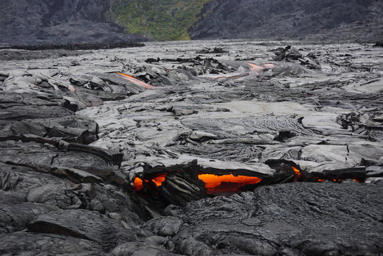 Lava field with new hot flowing lava in Big Island in Hawaii