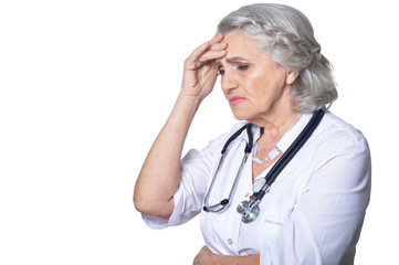 Portrait of female senior doctor on white background