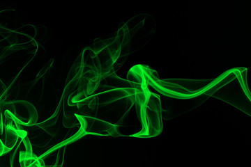 Green Smoke abstract on black background and darkness concept