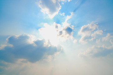 Fototapeta na wymiar Sun light ray and blue sky white clouds heavenly scenic bright environment