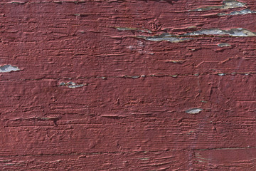 Background of dark red aged paint on a wall