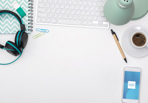 White Desk with Smartphone and Office Supplies Mockup