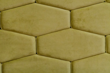 Background of a light green textile material with hexagonal design