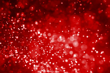 Plakat Glitter lights red abstract background. Defocused bokeh illustration