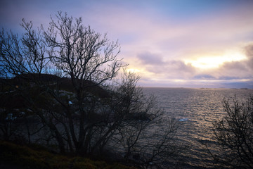 Obraz na płótnie Canvas clouds sunset over sea in Norway 