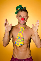 Summer and party. Sexy clown, bright background.