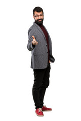 Handsome man with glasses shaking hands for closing a good deal over isolated white background