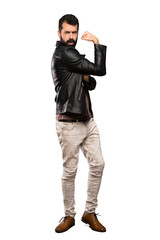 Naklejka premium Handsome man with beard doing strong gesture over isolated white background