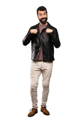 Fototapeta premium Handsome man with beard with surprise facial expression over isolated white background
