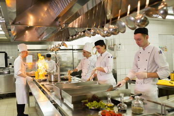 Fototapeta na wymiar work of a group of chefs in a luxury restaurant.