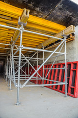 Wooden beams and scaffolding at the construction of the tunnel