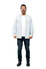Fototapeta premium Full-length shot of Handsome man with beard shouting to the front with mouth wide open over isolated white background