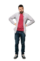 Fototapeta premium Full-length shot of Handsome man with beard angry over isolated white background