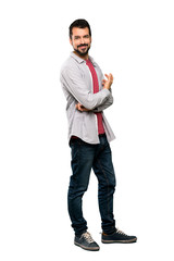Full-length shot of Handsome man with beard smiling over isolated white background