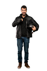 Naklejka premium Full-length shot of Biker man with surprise facial expression over isolated white background