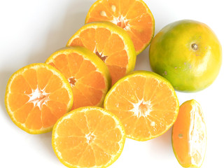 Citrus fruits, cut, sliced isolated on a white background.