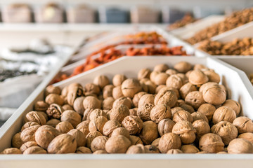 walnuts in the store. bowl of mixed nuts. 