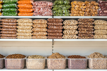 nuts and dried fruits in market. organic healthy snacks.