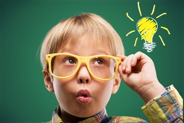 Portrait of a cute young boy with glasses isolated on  background. Studio shot.