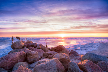 Winter seascape of breakwaters on frozen Baltic sea