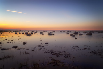 Beautiful seascape with stones. Sunset at the Baltic sea