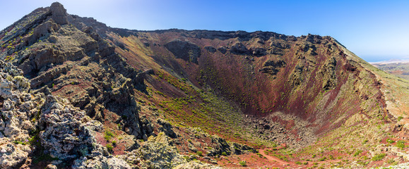 Spain, Lanzarote, XXL panorama from crater rim on top of majestic volcano crater of mountain corona