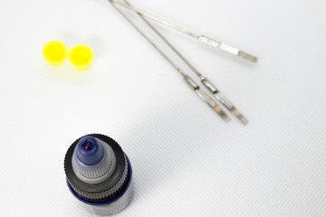 Tattoo equipment, tattoo ink and needle on white background