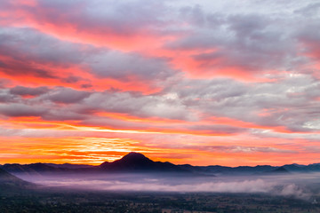 Sunrise at Phu Thok, view misty morning  around with mist and cloudy sky,  beautiful mountain. Khan District, Loei, Thailand