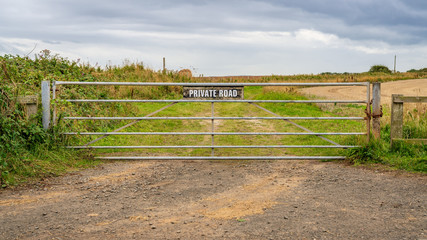 Sign: Private Road, seen in Low Hauxley in Northumberland, England, UK