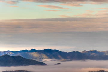 Sunrise at Phu Thok, view misty morning  around with mist and cloudy sky,  beautiful mountain. Khan District, Loei, Thailand