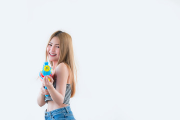 Asian sexy woman with gun water in hand on white background,Festival songkran day at thailand,The best of festival of thai,Land of  smile