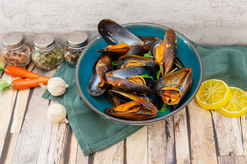 Mussel with white wine sauce on table