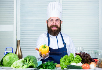 Dieting and organic food, vitamin. Healthy food cooking. Bearded man cook in kitchen, culinary. Vegetarian. Mature chef with beard. Chef man in hat. Secret taste recipe. Food decoration