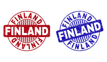 Grunge FINLAND round stamp seals isolated on a white background. Round seals with grunge texture in red and blue colors. Vector rubber imprint of FINLAND title inside circle form with stripes.