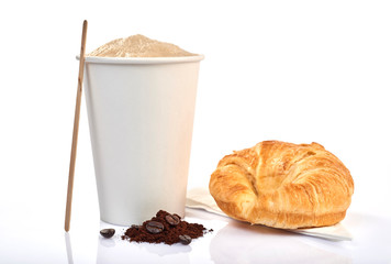 coffee cup and croissant isolated on a wooden table