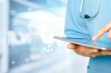 Close-up Doctor at hospital working with tablet pc