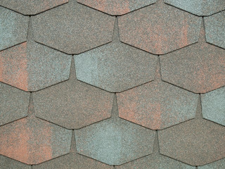 closeup of modern heaxgon roof shingles tiles. waterproof scabrous rough surface for house exterior...