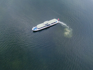 Aerial view of passenger ferry ship cruising on a lake in Switzerland.