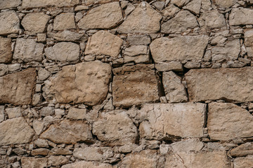 Old stone wall texture, blocks of ancient castle surface as background for design