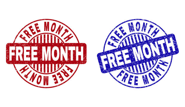 Grunge FREE MONTH round stamp seals isolated on a white background. Round seals with grunge texture in red and blue colors. Vector rubber overlay of FREE MONTH text inside circle form with stripes.
