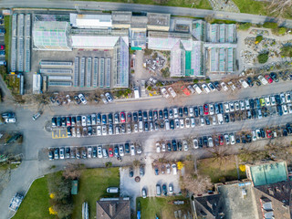 Aerial view of parking next to greenhouse